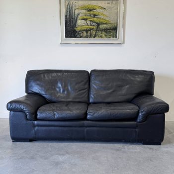 Canapé vintage Roche Bobois – modèle Soleil Noir – cuir noir patiné – 2 places